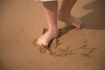 Children's feet in the sand