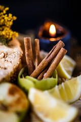 Biscuit apple pie with cinnamon, citron, oriental spices and sugar powder on dark background