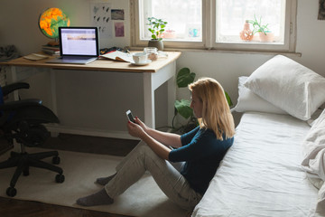 Freelancer working on her phone