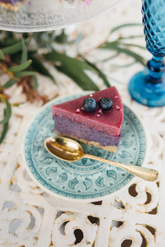 Outdoor iron table with vegan cake