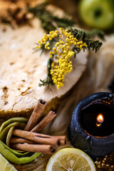 Biscuit apple pie with cinnamon, citron, oriental spices and sugar powder on dark background