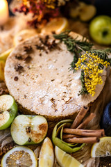 Biscuit apple pie with cinnamon, citron, oriental spices and sugar powder on dark background