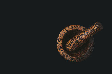 Wooden mortar and pusher for grinding allspice kitchen, with a pleasant warm tint