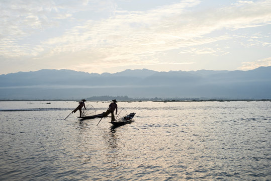 Two traditional Shan fishermen at Inle Lake, Myanmar.