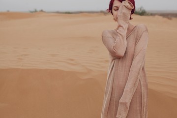 Emotional portrait of woman in desert