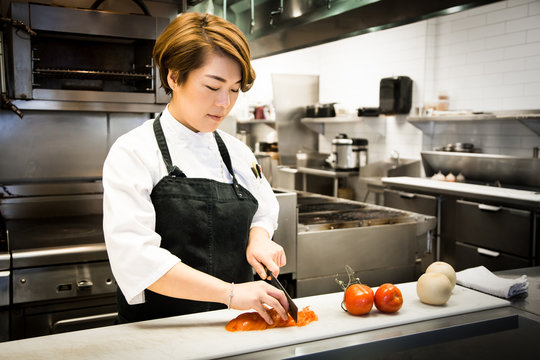 Female Chef Preps Tomatoes