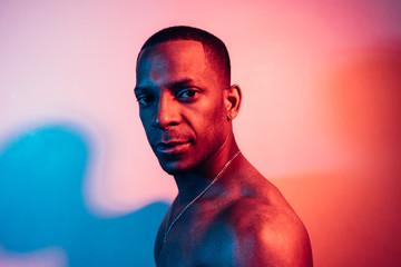 Portrait Of A Man Under Blue And Red Lights