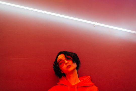 young asian woman with neon light