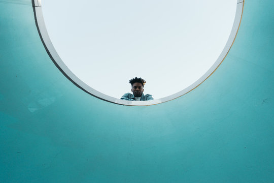 Young man in an abstract architectural space