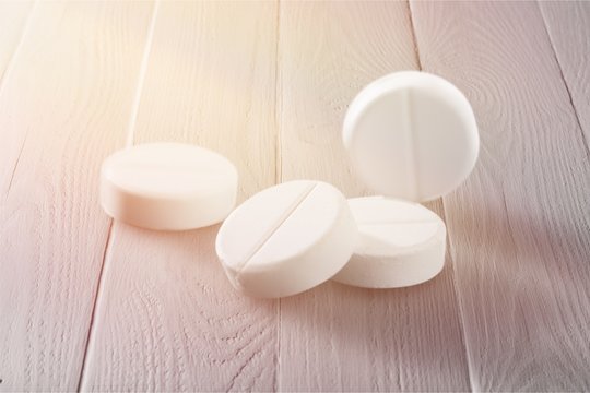 Medicine white pills on  background