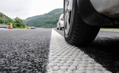 Modern highway safety markings on tarmac