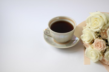 cup of coffee and wedding bouquet
