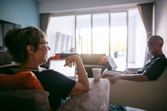 Couple using technolgy at home