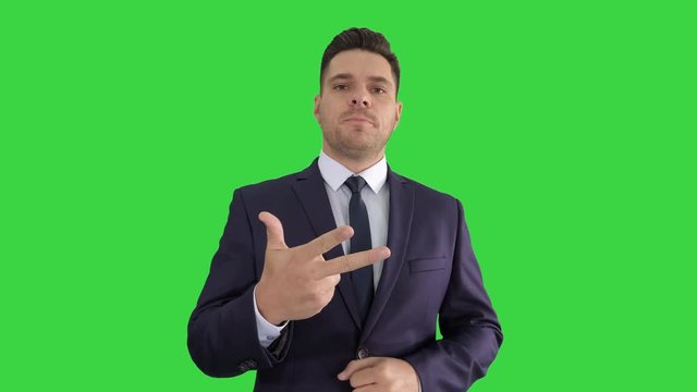 Businessman manager giving short business tips Training on a Green Screen, Chroma Key.
