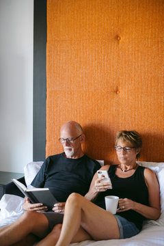 Couple using technolgy at home