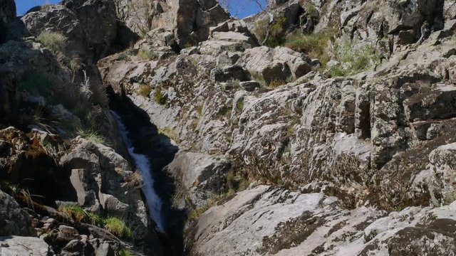 beautiful waterfall in Jerte valley pan down 