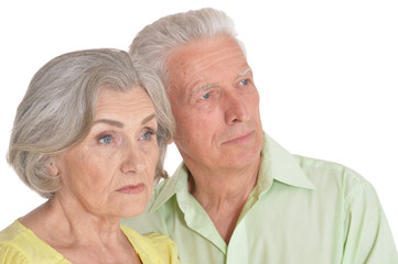 Portrait of calm senior couple on white background