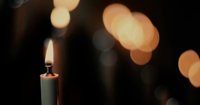 4k footage of a burning candle inside a church