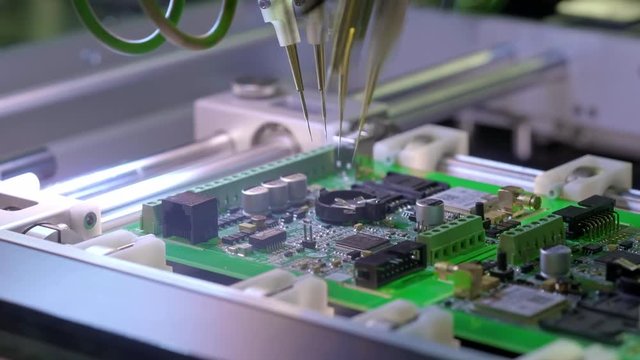 Electronic circuit board production. Automated Circut Board machine Produces Printed digital electronic board. Electronics contract manufacturing. Manufacture of electronic chips. High-tech.
