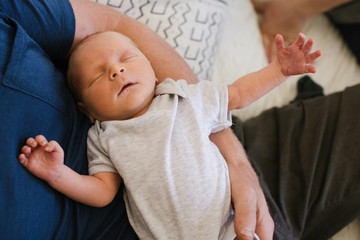 Man holding new baby inside.