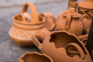 Close up of a market for handmade ceramic pots. Flower delves, painted ceramics. Shallow depth of focus.