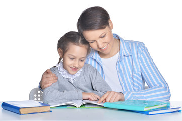 Mother with daughter reading books isolated on white background