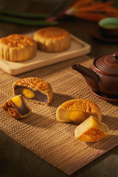 Mooncakes with teapot on table