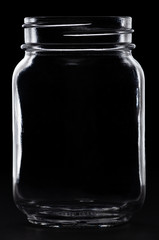glass mason jar on black bakground