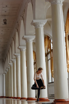 Ballroom dancer preparing shoes in hall