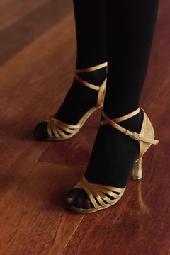 Crop woman in dancing shoes