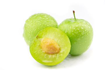 fresh and green plum on white background