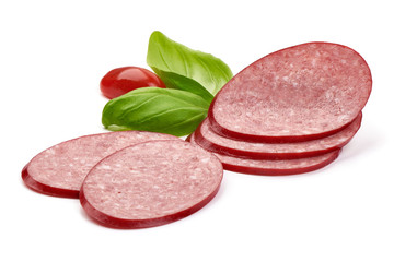 Sliced dry salami sausage with basil leaves, close-up, isolated on white background