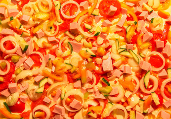 Pizza with tomatoes, onion and meat raw ingredients