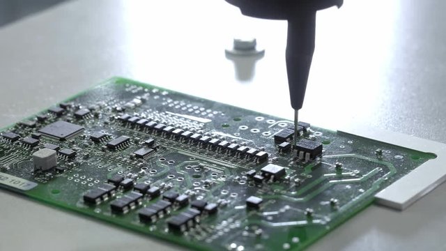 Electronic circuit board production. Automated Circut Board machine Produces Printed digital electronic board. Electronics contract manufacturing. Manufacture of electronic chips. High-tech.