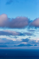 Obraz premium View across Isfjord in Svalbard, Blue water with boat and glaciers in the background, Halfmoon, Svalbard, Spitsbergen, Norway