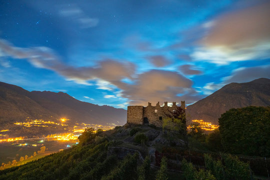 Starry sky over ruins of Castel Grumello, Lombardy, Italy