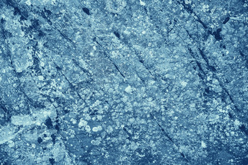 Fototapeta na wymiar Vintage blue background. Rough painted wall of sapphire color. Imperfect plane of blue colored. Uneven old decorative toned backdrop of cyan tint. Texture of sapphirine hue. Ornamental stony surface.