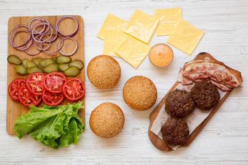 Cheeseburger ingredients, top view. From above, overhead, flat lay. Close-up.