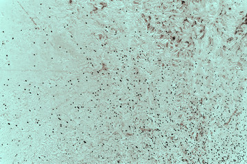 Vintage cyan background. Rough painted wall of hazel color. Imperfect plane of brown colored. Uneven old decorative toned backdrop of blue tint. Texture of azure hue. Ornamental stony surface.