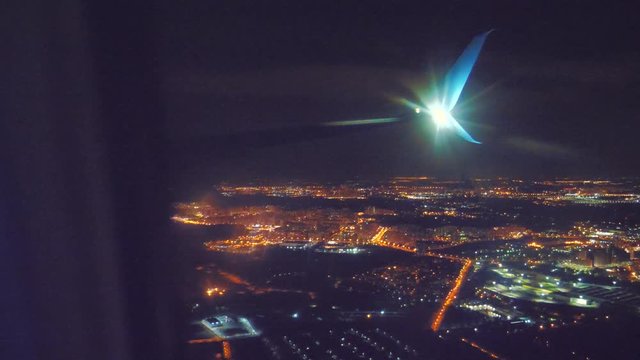 takeoff airplane aircraft flight concept. the plane taking off at night at the airport strip. plane landing. the view lifestyle from the window of the plane you can see the wing and the airfield