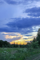 Beautiful cloudscape with blue sky and bright clouds at sunset in summer.