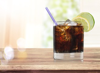 Glass of cola with ice cubes isolated
