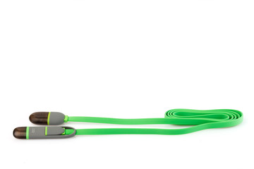 Green plastic cable USB-Lightning on white background. Close up