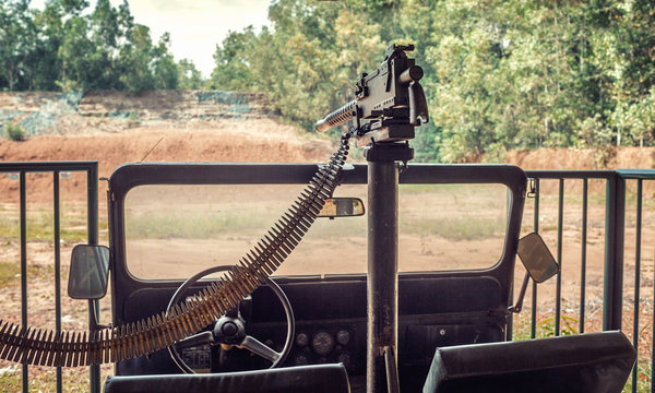 machine gun of the American army mounted on an SUV mounted in a dash near the cu Chi tunnels in Vietnam