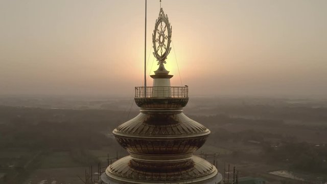 Chakra on temple top, India 4k aerial drone ungraded/flat 