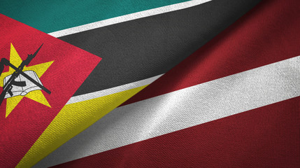 Mozambique and Latvia two flags textile cloth, fabric texture