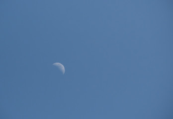 moon's waxing crescent in July sky