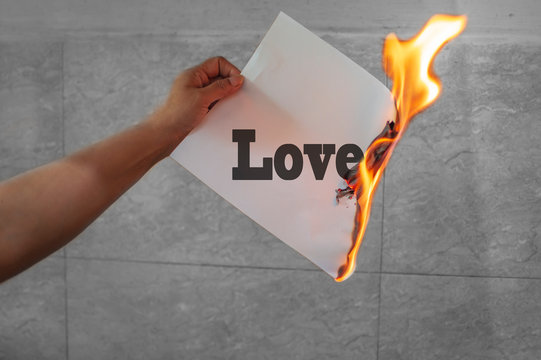 Love Text Burning On Paper