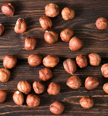 .hazelnuts top on wooden background