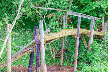 Fototapeta premium Old wooden bridge over the creek.